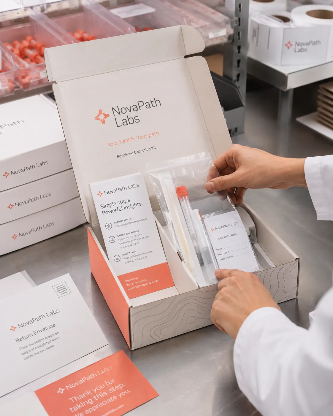A specimen collection kit from NovaPath Labs being prepared, showing vials, instructions, and branded packaging.